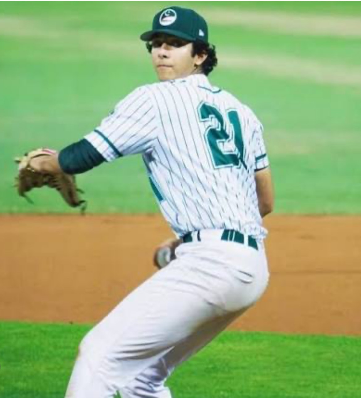 Pitcher #21 in pinstripe uniform mid-delivery