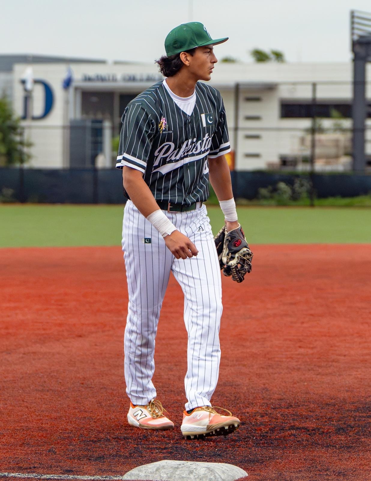 Pakistan Baseball official pinstripe jersey — player at base